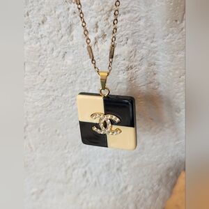 CHANEL Black and Bone Checkered Charm/Pendant